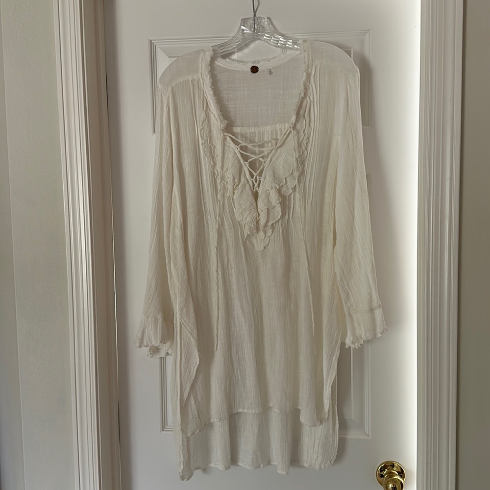 Free people gauze beach coverup or mini dress. Ruffled bell sleeve. Laceup front